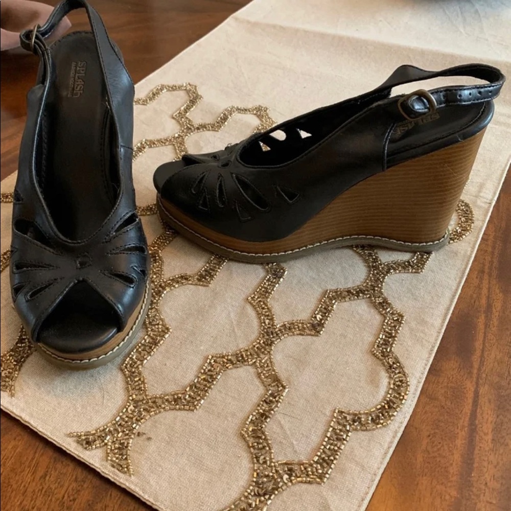 BLack and tan wedges with detailed peep toe.